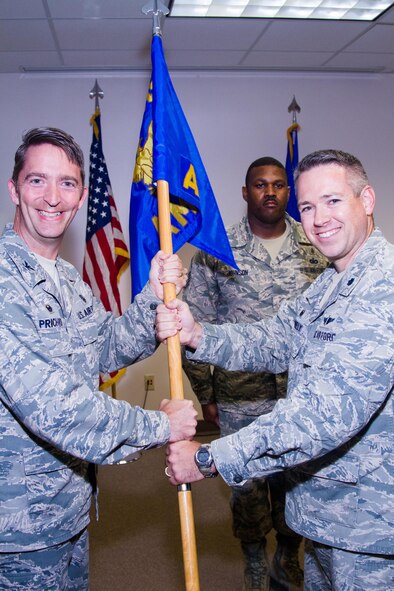 U.S. Air Force Lt. Col. Glenn Donnelly assumes command of the 20th Aerospace Medicine Squadron from Col. Curt Prichard, 20th Medical Group commander, during a change of command ceremony at Shaw Air Force Base, S.C., June 18, 2014. Donnelly served as commander of the 45th Aerospace Medicine Squadron at Patrick AFB, Fla. (Courtesy photo)
