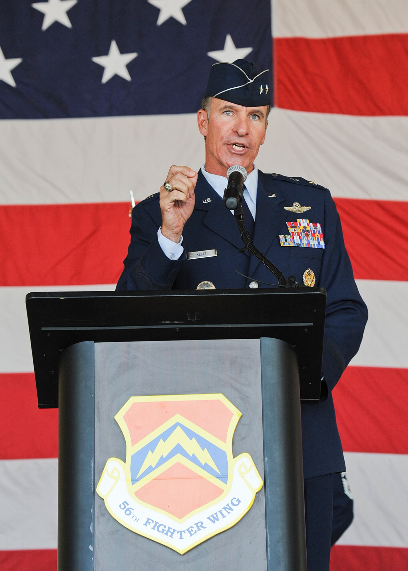 Maj. Gen. Michael Keltz, director of intelligence, operations and nuclear integration at Air Education and Training Command headquarters, officiates the 56th Fighter Wing change of command ceremony at Luke Air Force Base on June 20. Brig. Gen. Scott Pleus assumed command from outgoing commander Brig. Gen. Michael Rothstein. (U.S. Air Force photo/Staff Sgt. Darlene Setlmann)