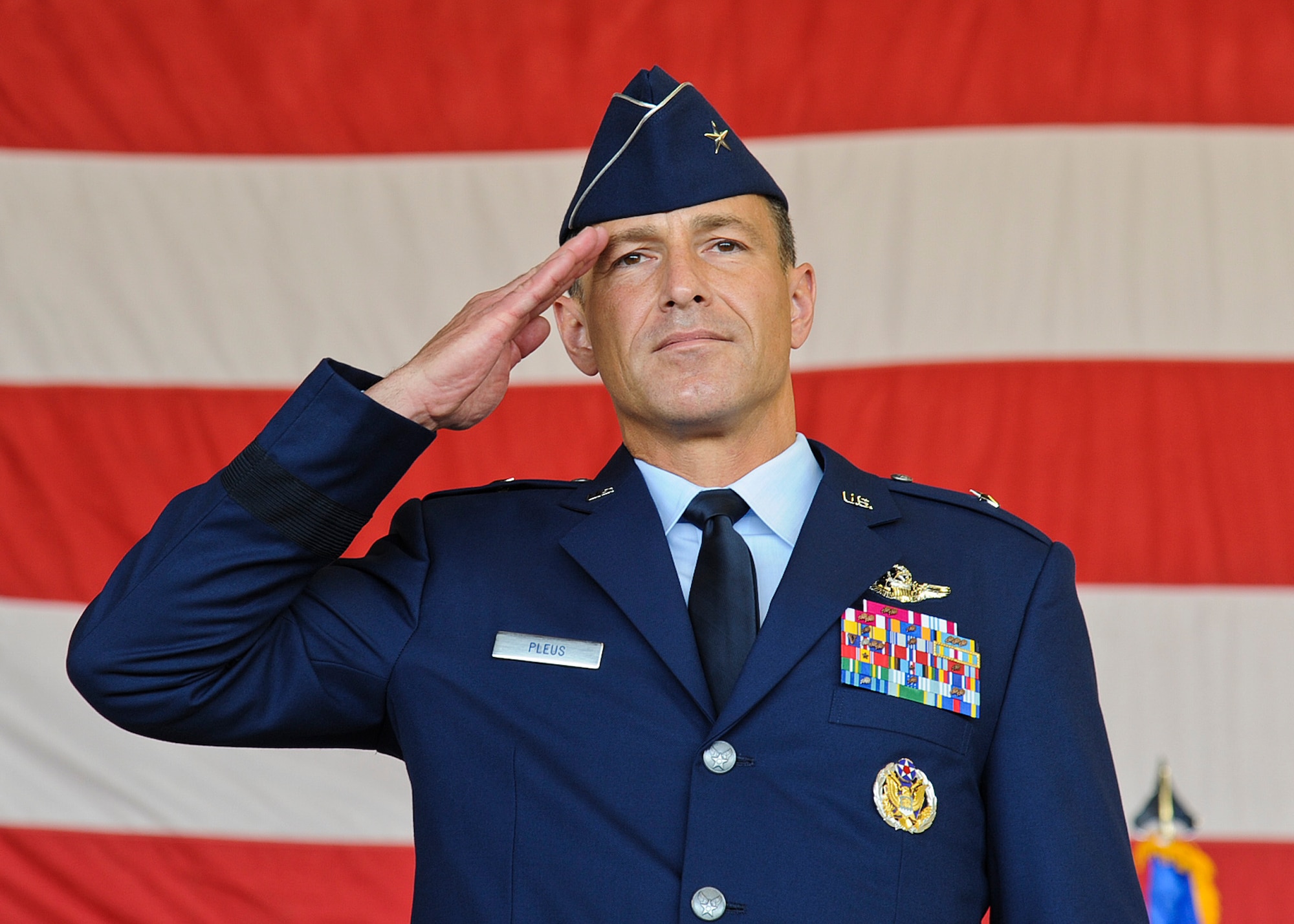 Brig. Gen. Scott Pleus, 56th Fighter Wing commander, renders his first salute to the wing after assuming command during a ceremony June 20 at Luke Air Force Base. (U.S. Air Force photo/Staff Sgt. Darlene Setlmann)