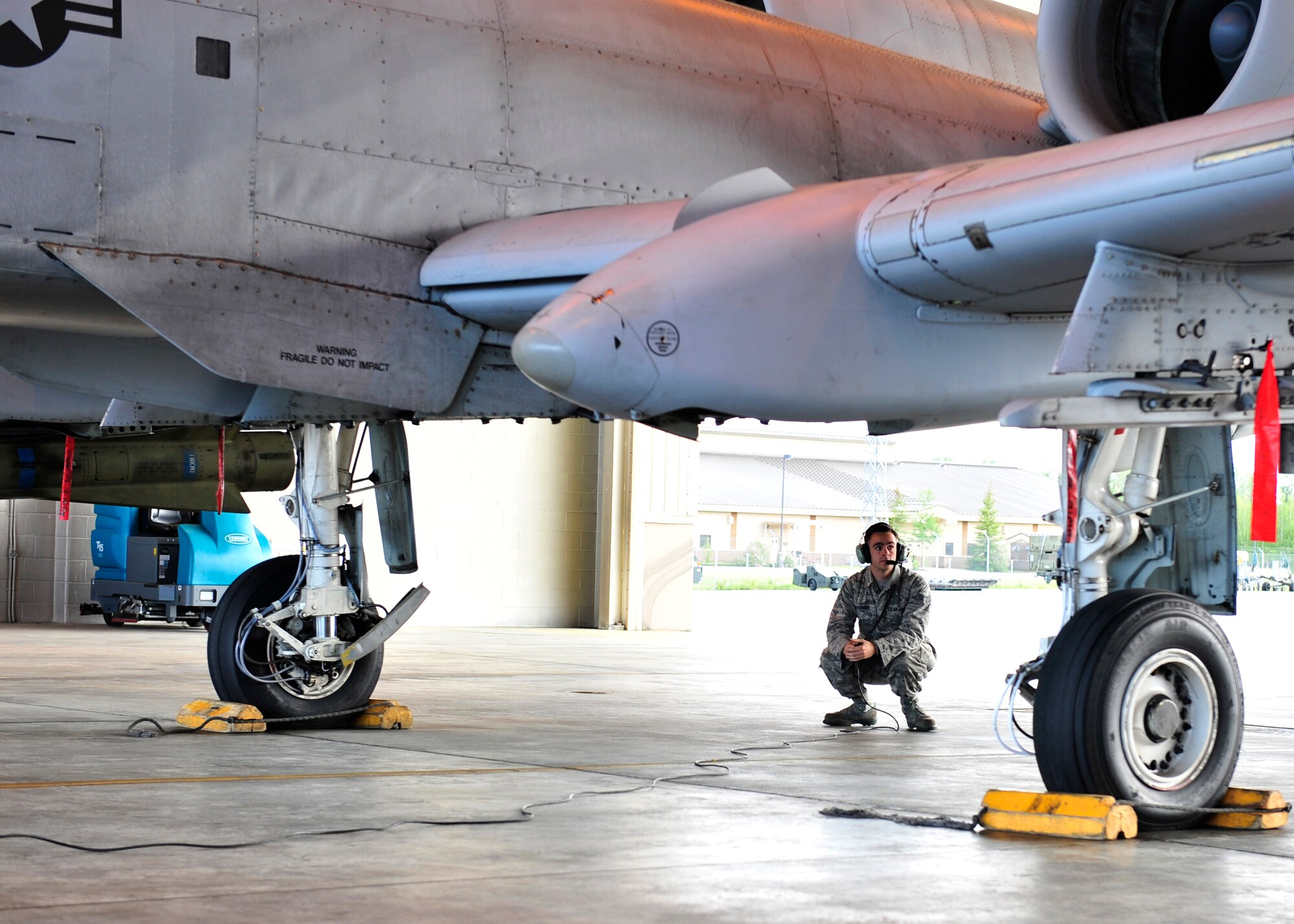 U.S. Air Force Senior Airman Michael Stedman, 51st Aircraft Maintenance Squadron crew chief assigned to Osan Air Base, South Korea, performs preflight inspections during RED Flag-Alaska 14-2 June 20, 2014, Eielson Air Force Base, Alaska. Stedman prepared the A-10 Thunderbolt II so a pilot from the 25th Fighter Squadron could fly safely. (U.S. Air Force photo by Senior Airman Ashley Nicole Taylor/Released)