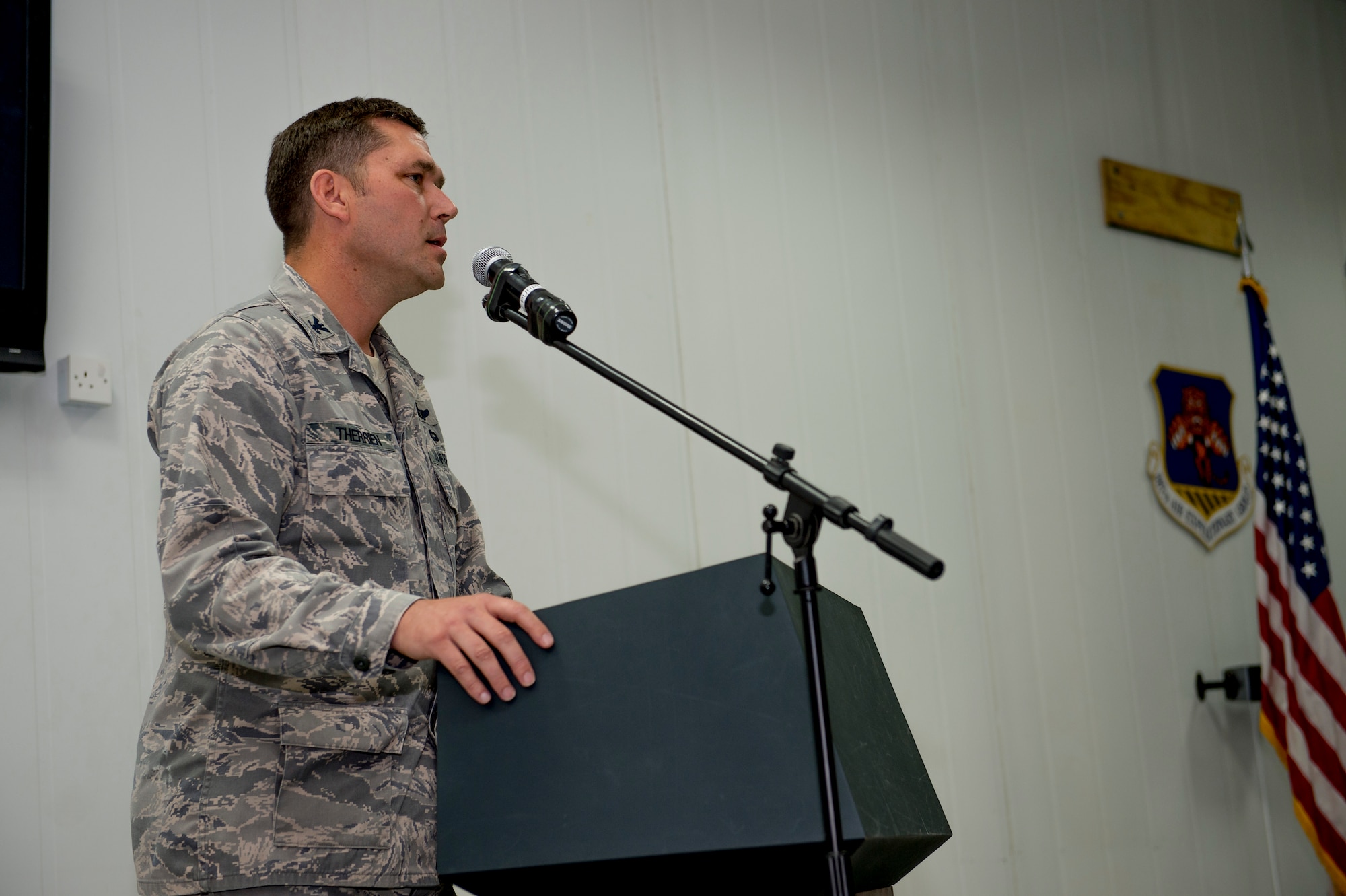 U.S. Air Force Col. Kevin Therrien speaks to Airmen after assuming command of the 387th Air Expeditionary Group during a change of command ceremony June 22, 2014 at an undisclosed location in Southwest Asia. Therrien comes from the Pentagon in Arlington, Virginia where he served as the joint staff, strategic plans and policy, north and west Africa division chief. (U.S. Air Force photo by Staff Sgt. Jeremy Bowcock)