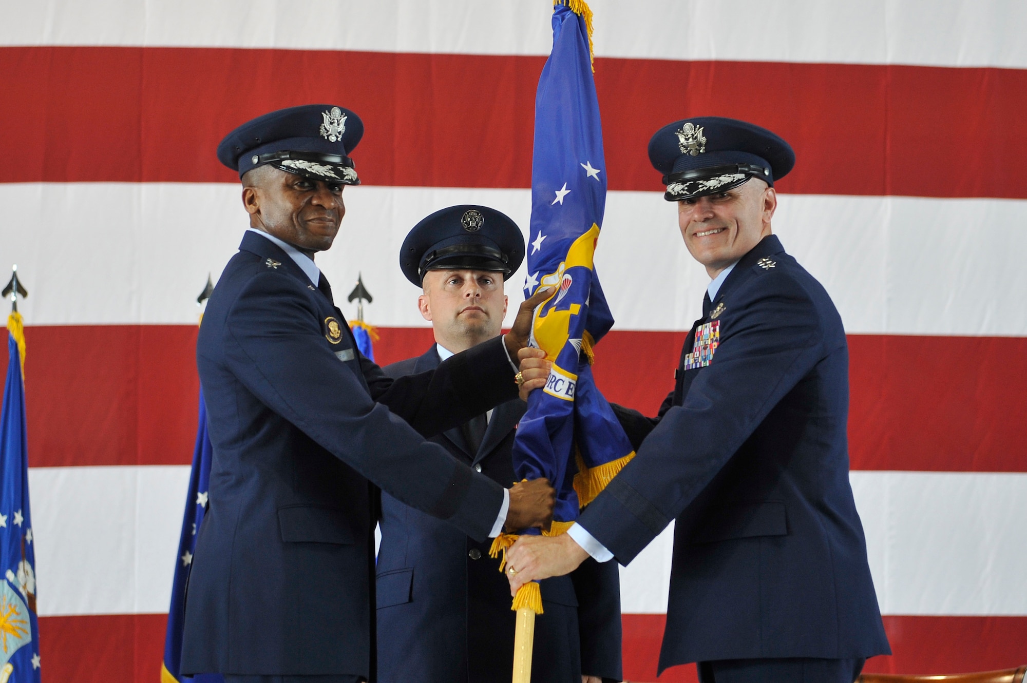 Lt. Gen. Carlton D. Everhart II assumes command of 18th Air Force from Gen. Darren W. McDew, Air Mobility Command commander, at Scott Air Force Base, Ill., June 20, 2014. Everhart previously commanded the 3rd Air Force out of Ramstein Air Base, Germany. (U.S. Air Force photo/Staff Sgt. Jonathan Fowler)