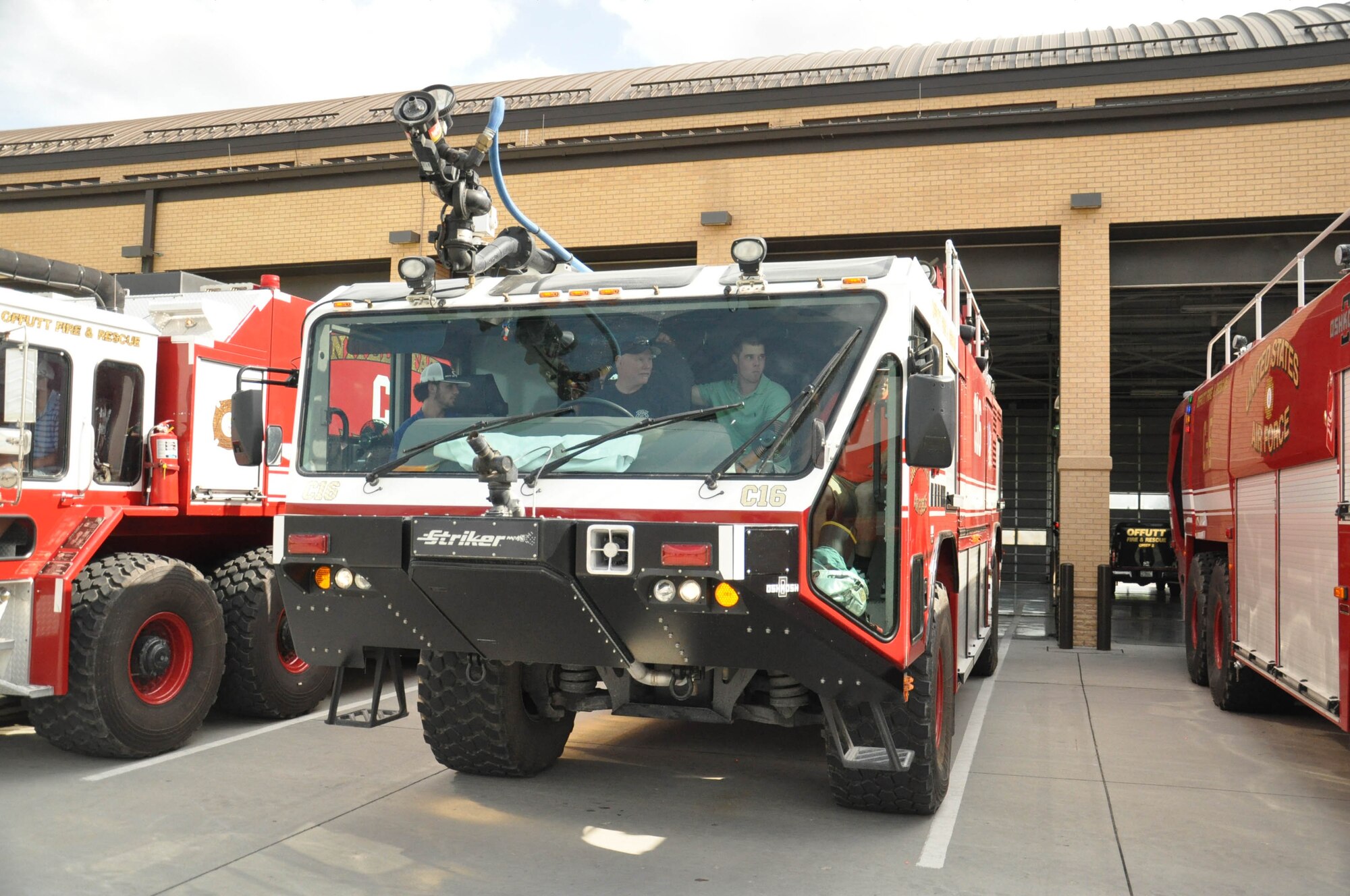 Players for the Vanderbilt University baseball team learn about the fire engines on Offutt Air Force Base, Nebraska, during a base tour June 18. The players got to ride in the trucks and learn how to use the hoses. (U.S. Air Force photo by 2nd Lt. Carly Costello)