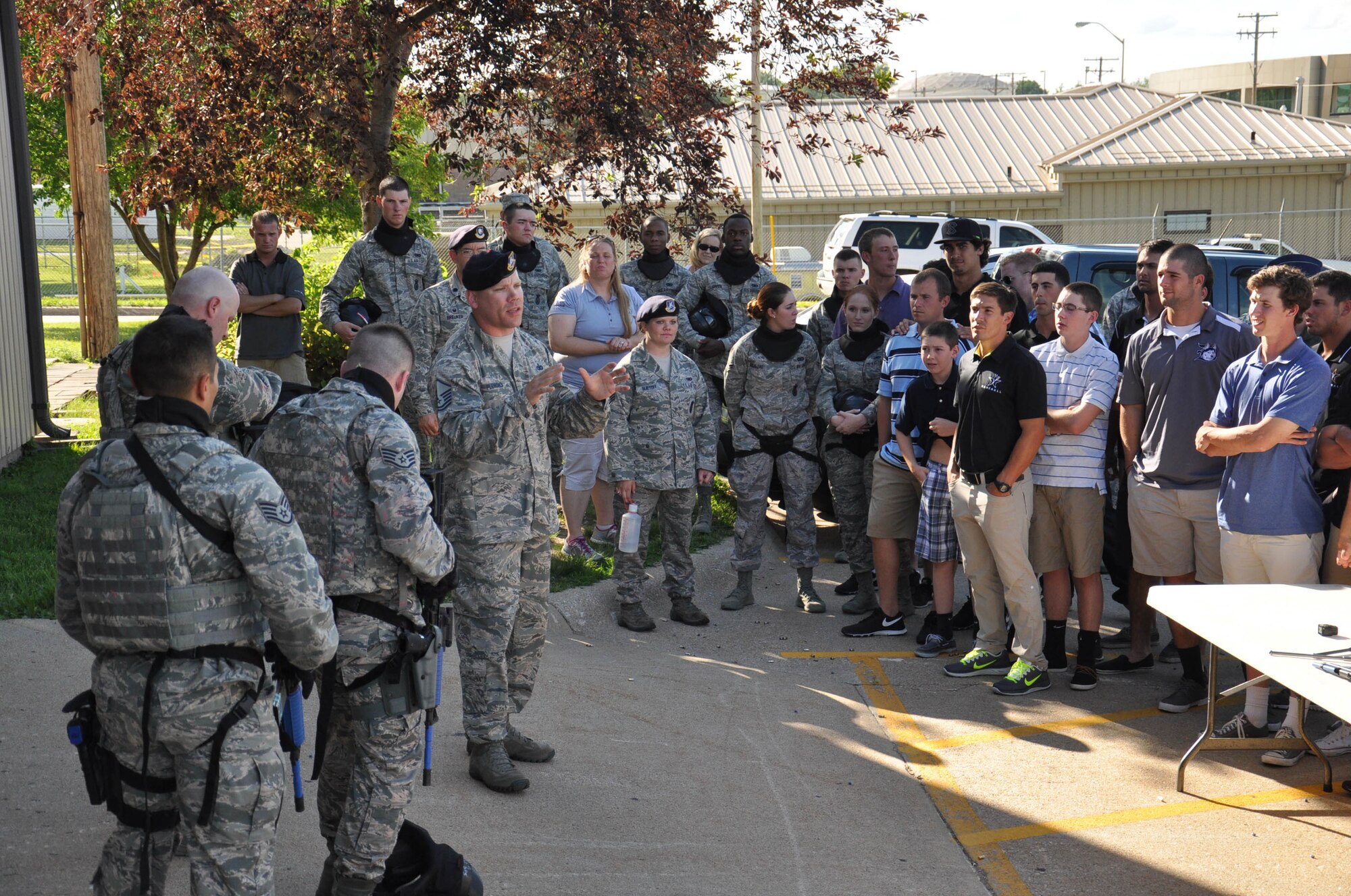 U.S. Air Force Master Sgt. John Plemons, 55th Security Forces Squadron, talks about the mission and capabilities of his team during an active shooter situation during a visit by the Vanderbilt University baseball team. The 55th Wing is sponsoring the team, who made it to the College World Series hosted in Omaha. (U.S. Air Force photo by 2nd Lt. Carly Costello)