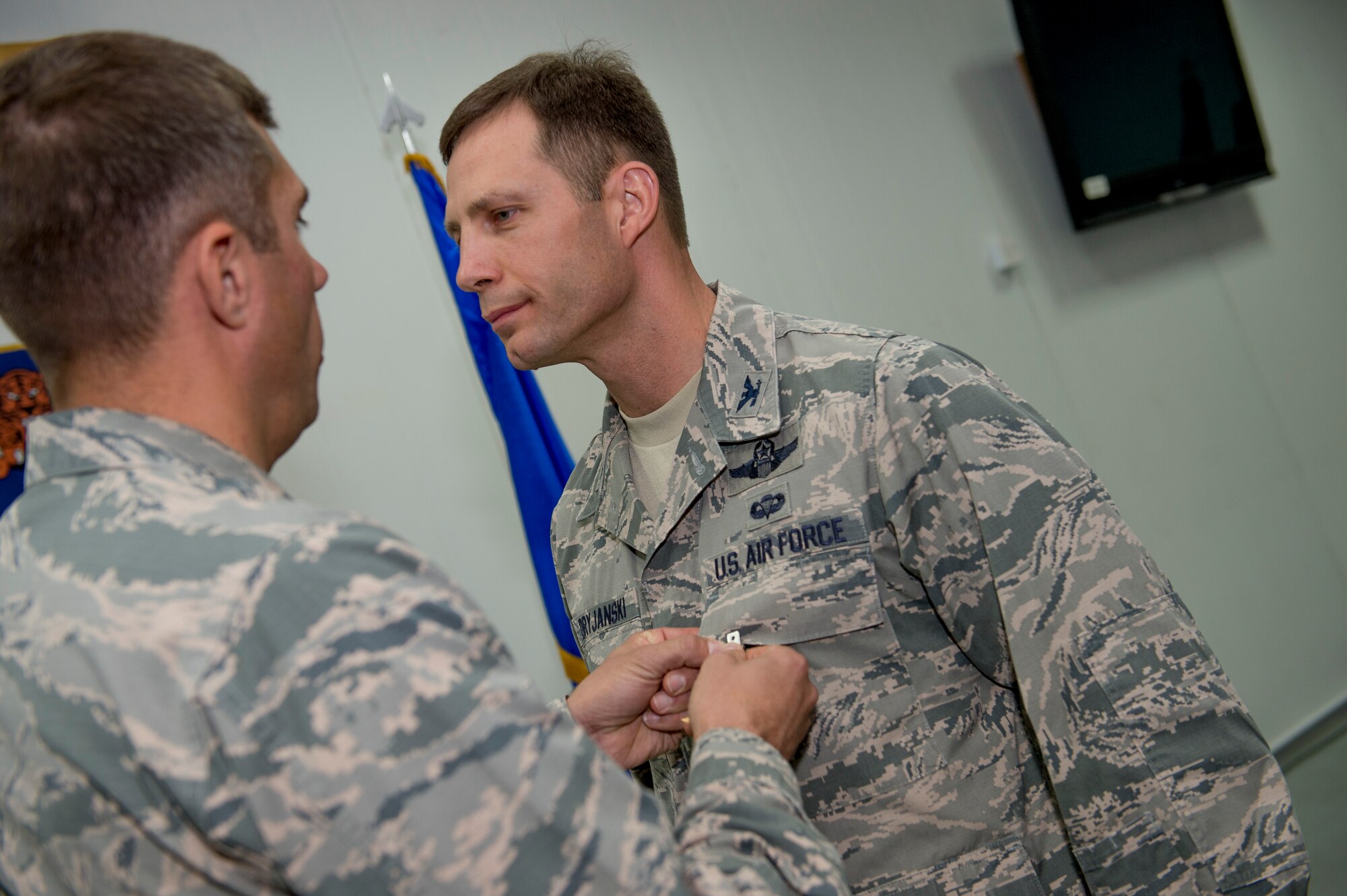 U.S. Air Force Col. John Klein, 386th Air Expeditionary Wing commander, presents Col. James Dryjanski, 387th Air Expeditionary Group commander, the Bronze Star June 22, 2014 at an undisclosed location in Southwest Asia. Dryjanski was awarded the medal just before relinquishing command of the 387th AEG during a formal change of command ceremony. (U.S. Air Force photo by Staff Sgt. Jeremy Bowcock)