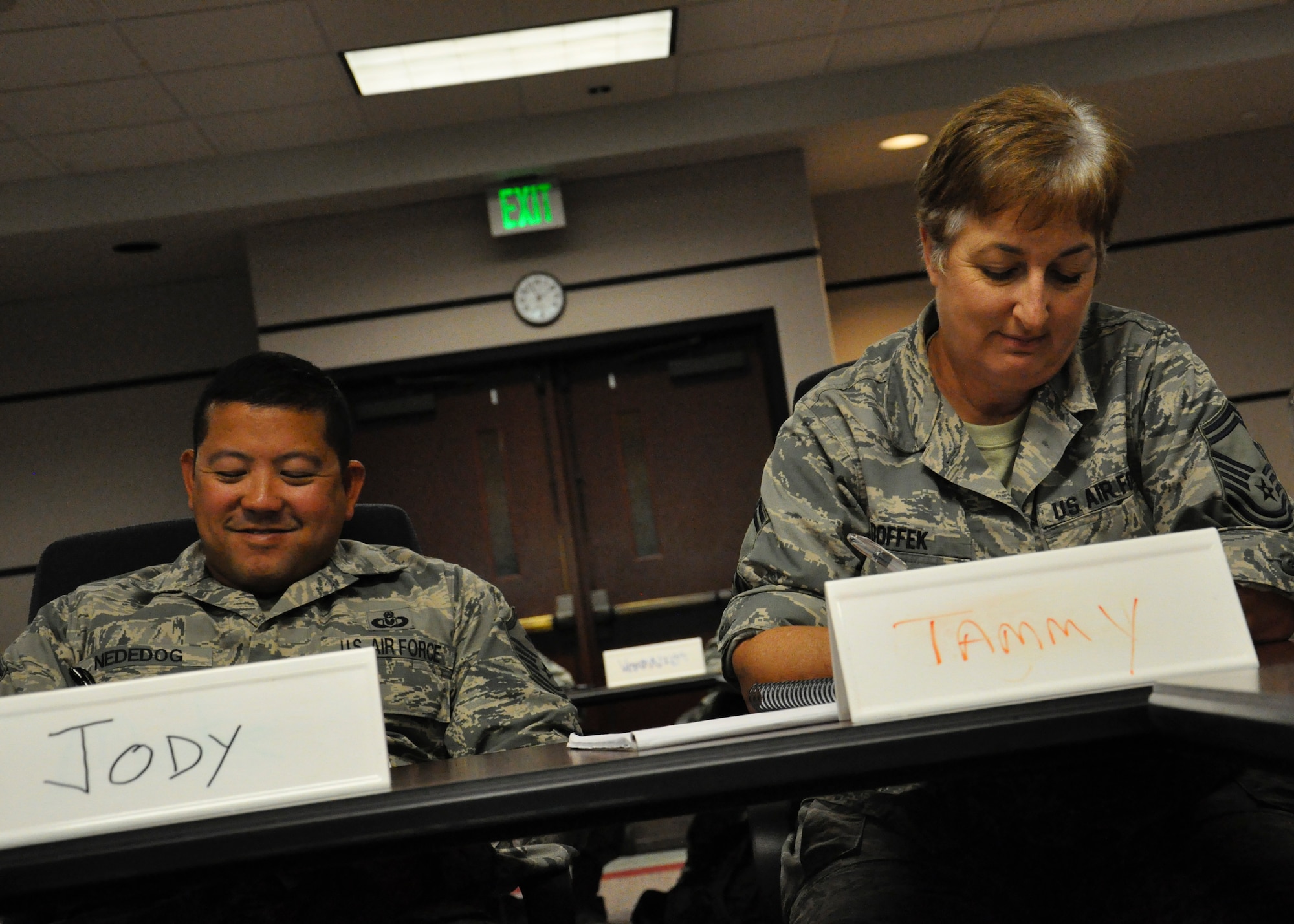 Master Sgt. Jody Nededog, 56th Operations Group first sergeant, and Senior Master Sgt. Tammy Doffek, 242nd Combat Communications Squadron computer operations section chief, take notes during the Master Resilience Trainer course on June 20. The course, held at the U.S. Air Force Expeditionary Center, is the AF's sole course responsible for training MRTs.
