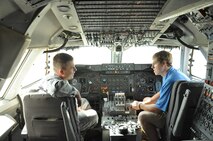 William Cooper, a junior outfielder for the Vanderbilt University baseball team, speaks with U.S. Air Force Master Sgt. Jarrod Williams, 55th Aircraft Maintenance Squadron production superintendent, while sitting in the cockpit of an E-4B June 15 at Offutt Air Force Base, Nebraska. Players from the team, along with their coaches and several family members visited the base for a tour and team dinner with members of Team Offutt. (U.S. Air Force photo by 2nd Lt. Carly Costello)