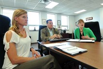 Aimee Salter, Offutt Spouse Resilience Program co-chair, and Jack Sweet, 55th Wing Community Support coordinator, listen to Joy Draper, Offutt Spouse Resilience Program co-chair, as she discusses positive thinking during a webinar inside the 55th Mission Support Group headquarters building June 11. Draper and Salter have worked with Sweet to tailor the Air Force resilience initiative to meet the specific needs of military spouses. (Photo by Charles Haymond/Released)