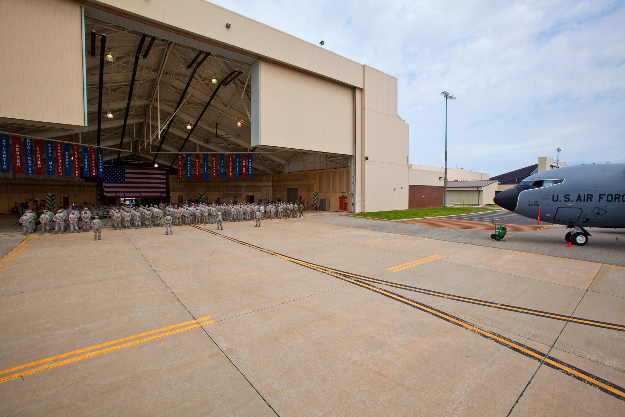 Col. Robert A. Meyer Jr. assumes command of the 108th Wing, New Jersey Air National Guard, from Brig. Gen. Kevin J. Keehn during a Change of Command ceremony at Joint Base McGuire-Dix-Lakehurst, N.J. June 22, 2014.  A change of command ceremony is a military tradition that represents the formal transfer of authority and responsibility for a unit from one commanding or flag officer to another. Since Sept. 11, 2001, the 108th Wing has deployed Airmen around the globe in support of Operation's Iraqi Freedom, Noble Eagle, Enduring Freedom and New Dawn. New Jersey's 21 counties, the homes of the Airmen that serve in the Wing, are represented by the banners hanging from the ceiling. (U.S. Air National Guard photo by Master Sgt. Mark C. Olsen/Released)