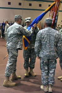 U.S. Army Lt. Col. Christopher M. Stallings accepts command of the 1st Battalion, 222nd Aviation Regiment from Col. Julius A. Rigole, 128th Avn. Brigade commander, during a change of command ceremony at Fort Eustis, Va., June 20, 2014.  The 1-222nd Avn. Reg. was transferred to the Training and Doctrine Command and provisionally attached to the U.S. Army Aviation Logistics School on May 20, 2008, at Fort Eustis. (U.S. Air Force photo by Staff Sgt. Katie Gar Ward/Released)