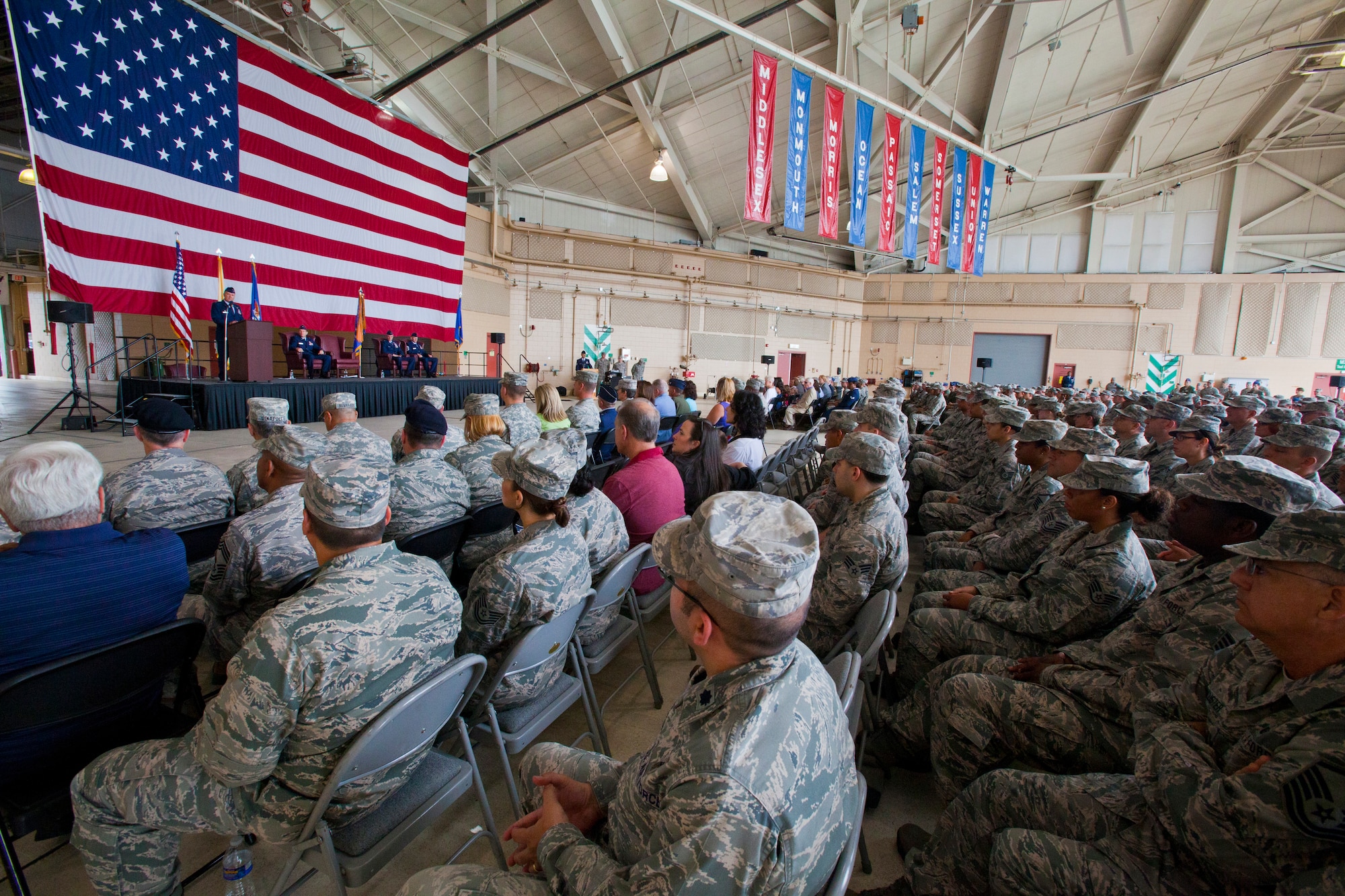 Col. Robert A. Meyer Jr., commander, 108th Wing, addresses the New Jersey Air National Guard leadership, family, friends and 108th Wing Members during a change of command ceremony at Joint Base McGuire-Dix-Lakehurst, N.J., June 22, 2014. A change of command ceremony is a military tradition that represents the formal transfer of authority and responsibility for a unit from one commanding or flag officer to another. Since Sept. 11, 2001, the 108th Wing has deployed Airmen around the globe in support of Operation's Iraqi Freedom, Noble Eagle, Enduring Freedom and New Dawn. (U.S. Air National Guard photo by Master Sgt. Mark C. Olsen/Released)