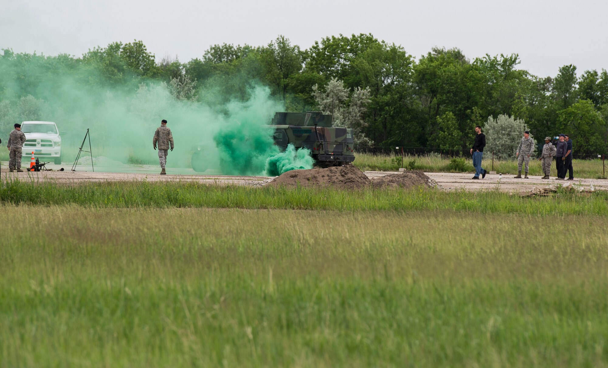 The 5th Civil Engineer Squadron conducted deployment training at Minot Air Force Base, N.D., June 18, 2014. Airmen from all ranks participated in training that taught them how to build a tent together, conduct a proper convoy and how to use some of the large mobile equipment used in a deployed environment. (U.S. Air Force photo/Senior Airman Andrew Crawford)