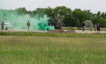 The 5th Civil Engineer Squadron conducted deployment training at Minot Air Force Base, N.D., June 18, 2014. Airmen from all ranks participated in training that taught them how to build a tent together, conduct a proper convoy and how to use some of the large mobile equipment used in a deployed environment. (U.S. Air Force photo/Senior Airman Andrew Crawford)
