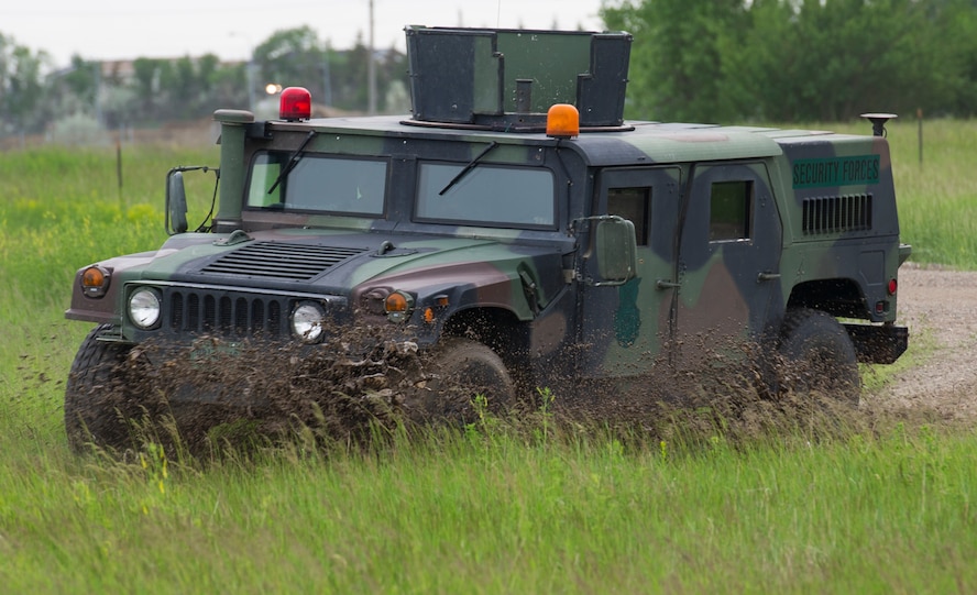 The 5th Civil Engineer Squadron conducted deployment training at Minot Air Force Base, N.D., June 18, 2014. Airmen from all ranks participated in training that taught them how to build a tent together, conduct a proper convoy and how to use some of the large mobile equipment used in a deployed environment. (U.S. Air Force photo/Senior Airman Andrew Crawford)