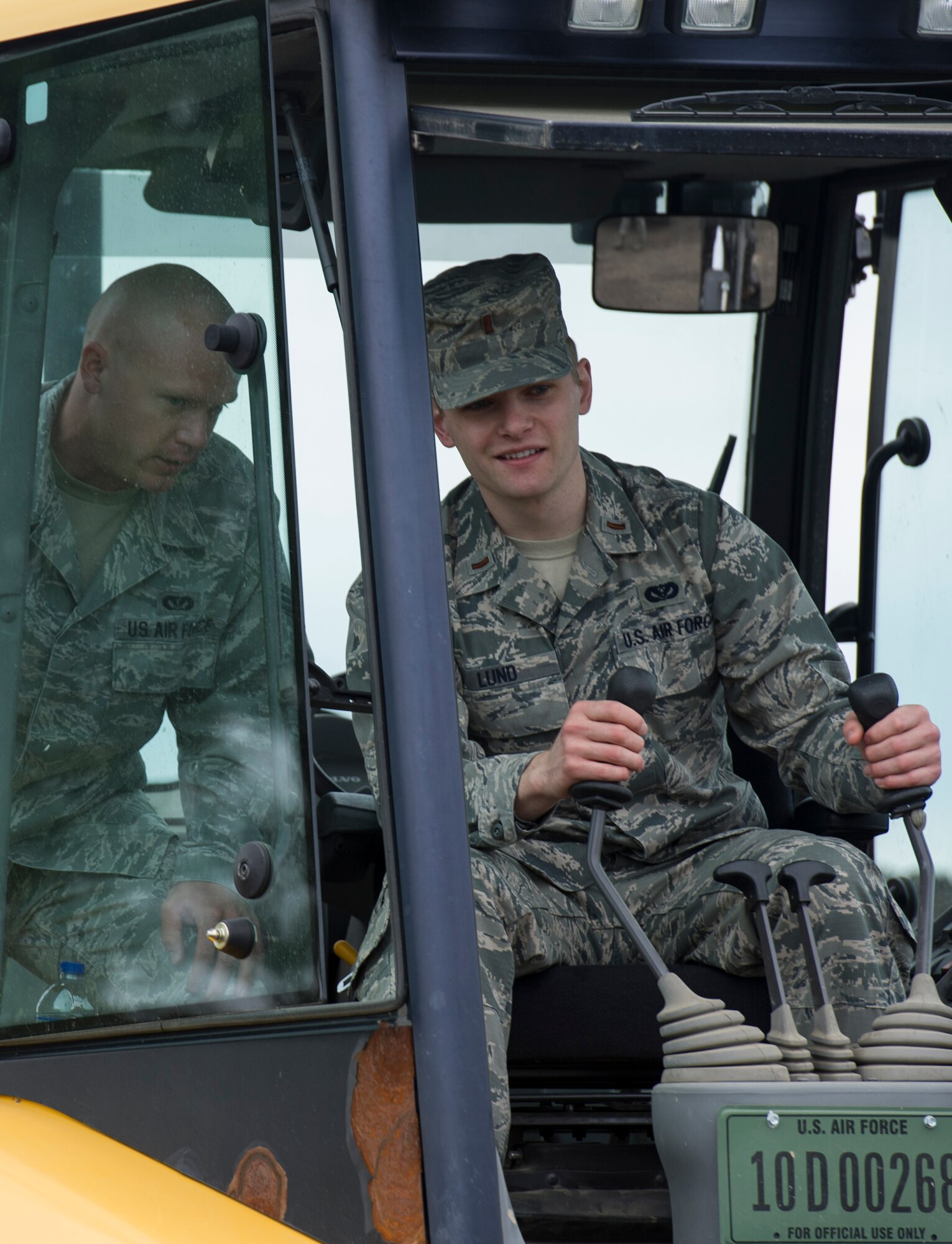 The 5th Civil Engineer Squadron conducted deployment training at Minot Air Force Base, N.D., June 18, 2014. Airmen from all ranks participated in training that taught them how to build a tent together, conduct a proper convoy and how to use some of the large mobile equipment used in a deployed environment. (U.S. Air Force photo/Senior Airman Andrew Crawford)