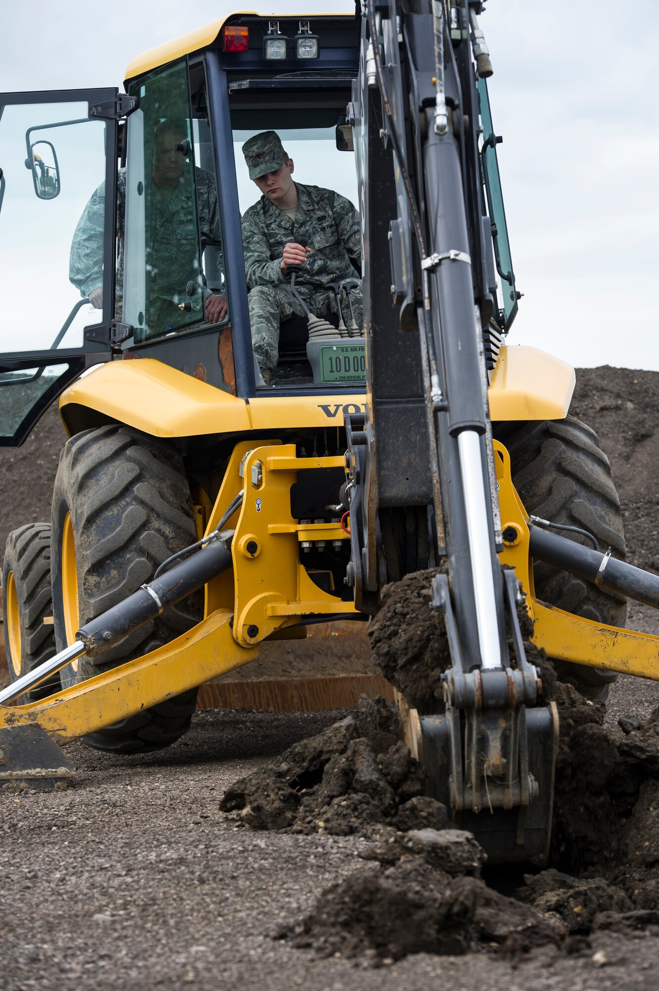 The 5th Civil Engineer Squadron conducted deployment training at Minot Air Force Base, N.D., June 18, 2014. Airmen from all ranks participated in training that taught them how to build a tent together, conduct a proper convoy and how to use some of the large mobile equipment used in a deployed environment. (U.S. Air Force photo/Senior Airman Andrew Crawford)