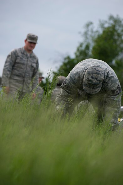 The 5th Civil Engineer Squadron conducted deployment training at Minot Air Force Base, N.D., June 18, 2014. Airmen from all ranks participated in training that taught them how to build a tent together, conduct a proper convoy and how to use some of the large mobile equipment used in a deployed environment. (U.S. Air Force photo/Senior Airman Andrew Crawford)