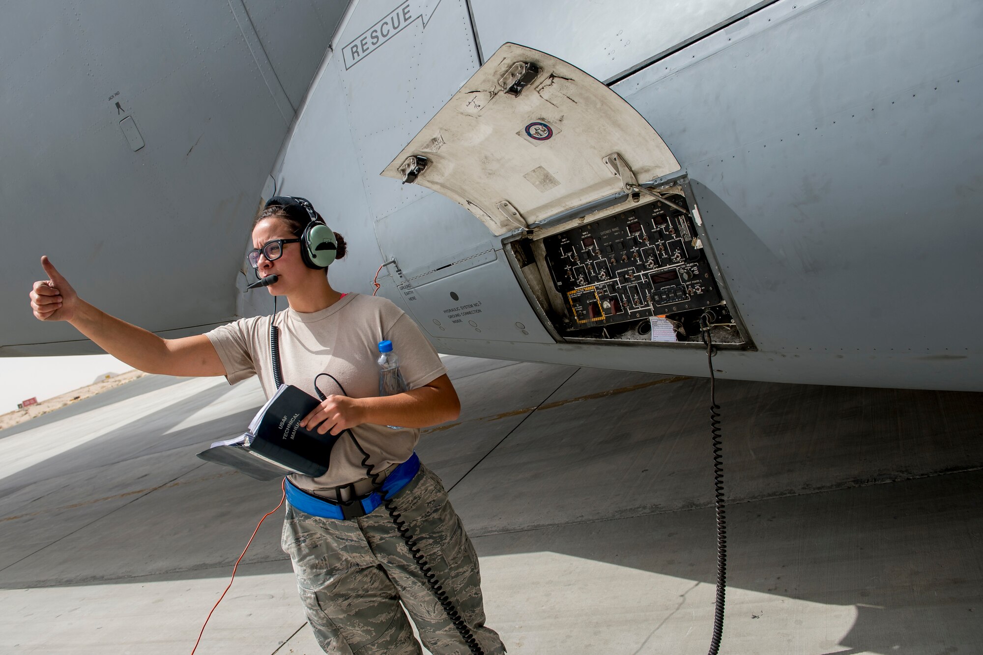 U.S. Air Force Airman 1st Class Jessica McKay, 5th Expeditionary Aircraft Mobility Squadron, checks fuel levels during refueling operations on a C-17 Globemaster III June 23, 2014 at an undisclosed location in Southwest Asia. McKay is deployed from Travis Air Force Base, Calif. in support of Operation Enduring Freedom and a native of Puyallup, Wash. (U.S. Air Force photo by Staff Sgt. Jeremy Bowcock)