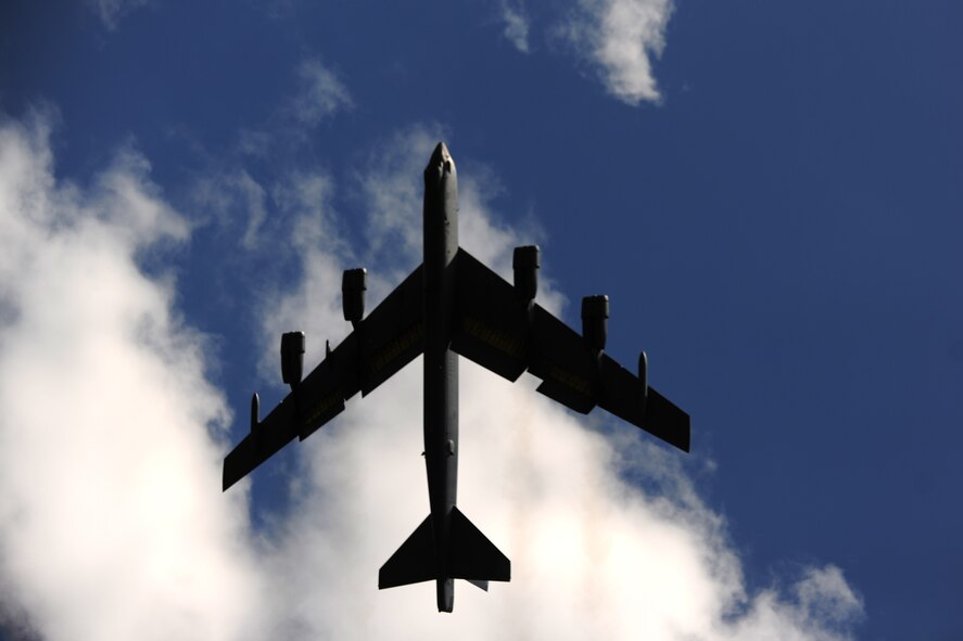 A B-52 Stratofortess passes over the flightline at RAF Fairford, United Kingdom, June 7, 2014. The bomber deployed to the United Kingdom as part of a multi-national training operation. (U.S. Air Force photo by Staff Sgt. Jarad A. Denton/Released)