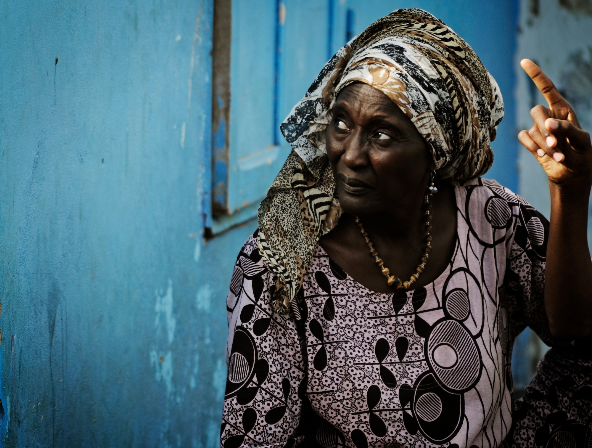 "Mama", Empire Les Enfants orphanage director, keeps an eye on the children during a U.S. Air Forces in Europe and Air Forces Africa rock band concert in Dakar, Senegal June 18, 2014. USAFE-AFAFRICA Airmen are in Senegal for African Partnership Flight, a program designed to improve communication and interoperabilty between regional partners in Africa. The band will be playing multiple venues in the area to inspire children and musicians through the universal language of music. (U.S. Air Force photo/ Staff Sgt. Ryan Crane)