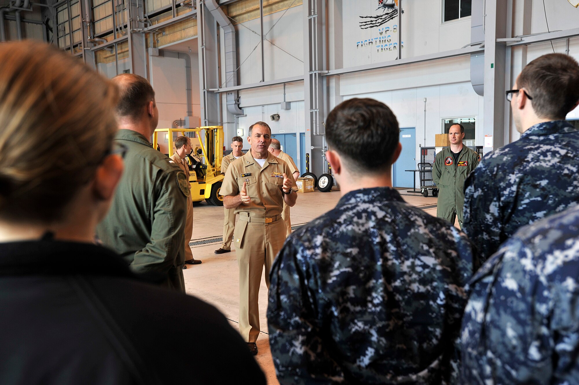 Rear Adm. Terry Kraft, center, U.S. Naval Forces Japan commander, talks with Sailors attached to Patrol Squadron (VP) 46 during an all hands call in the squadron’s hangar, June 19, 2014. Kraft is currently visiting Naval Air Facility (NAF) Misawa, and is using the opportunity to meet with Sailors, and to inspect the installation’s various facilities. VP-46 is currently deployed to NAF Misawa in support of U.S. 7th Fleet operations. (U.S. Navy photo by Senior Chief Mass Communication Specialist Daniel Sanford/Released)