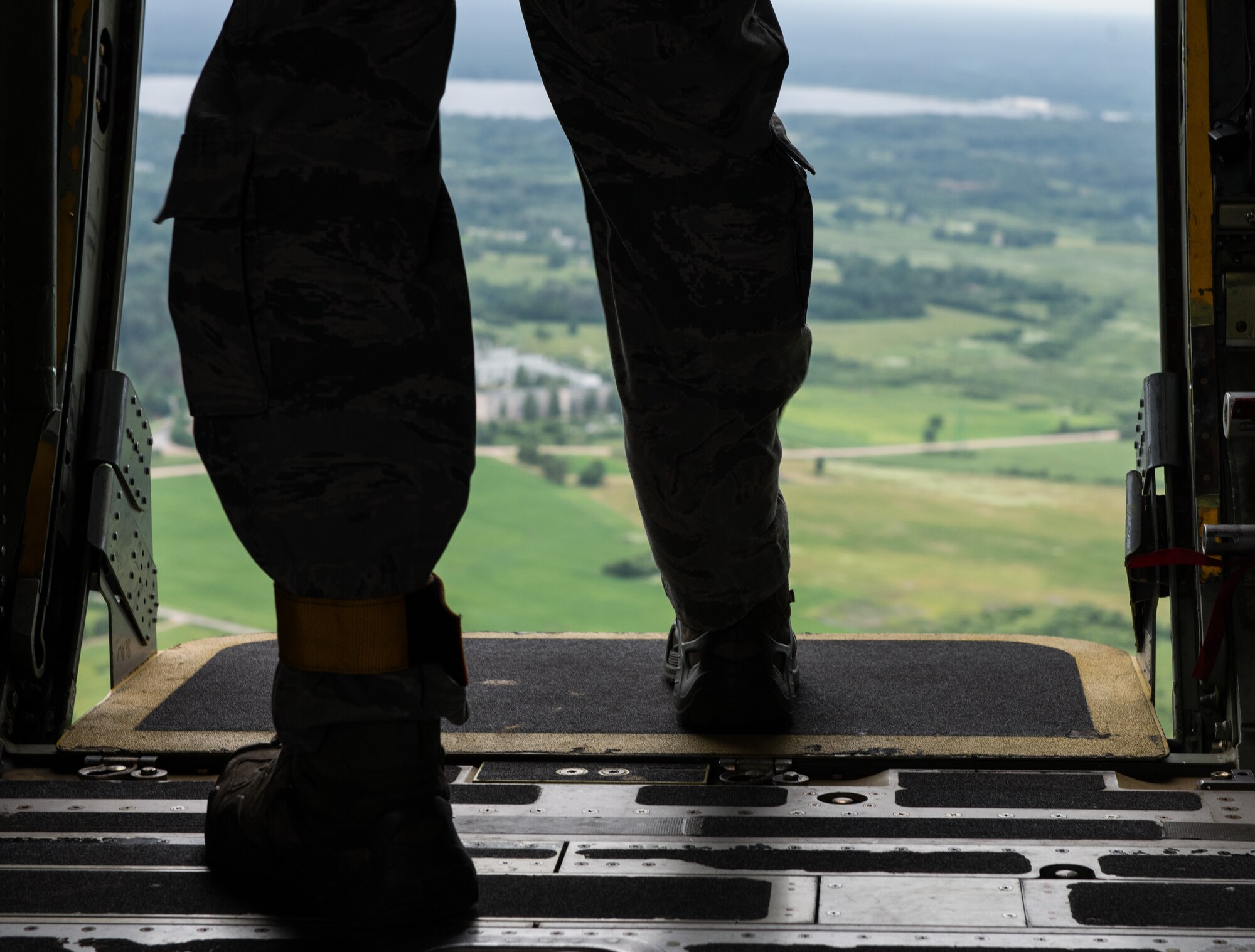 An Airman from the 435th Contingency Response Group, steps out before jumping from a C-130 J-model during the Air Force-specific portion of Saber Strike at Lielvarde Air Base, Latvia, June 17, 2014. During the final week of Saber Strike 2014 the 435th CRG, in conjunction with the 37th Airlift Squadron, trained on the full capabilities to open the Latvian air base. They also trained with Latvian and Estonian service members on airfield operations, command and control of air and space forces, weather support, and protection of operational forces, aircraft maintenance and aerial port services. (U.S. Air Force photo/Senior Airman Jonathan Stefanko)