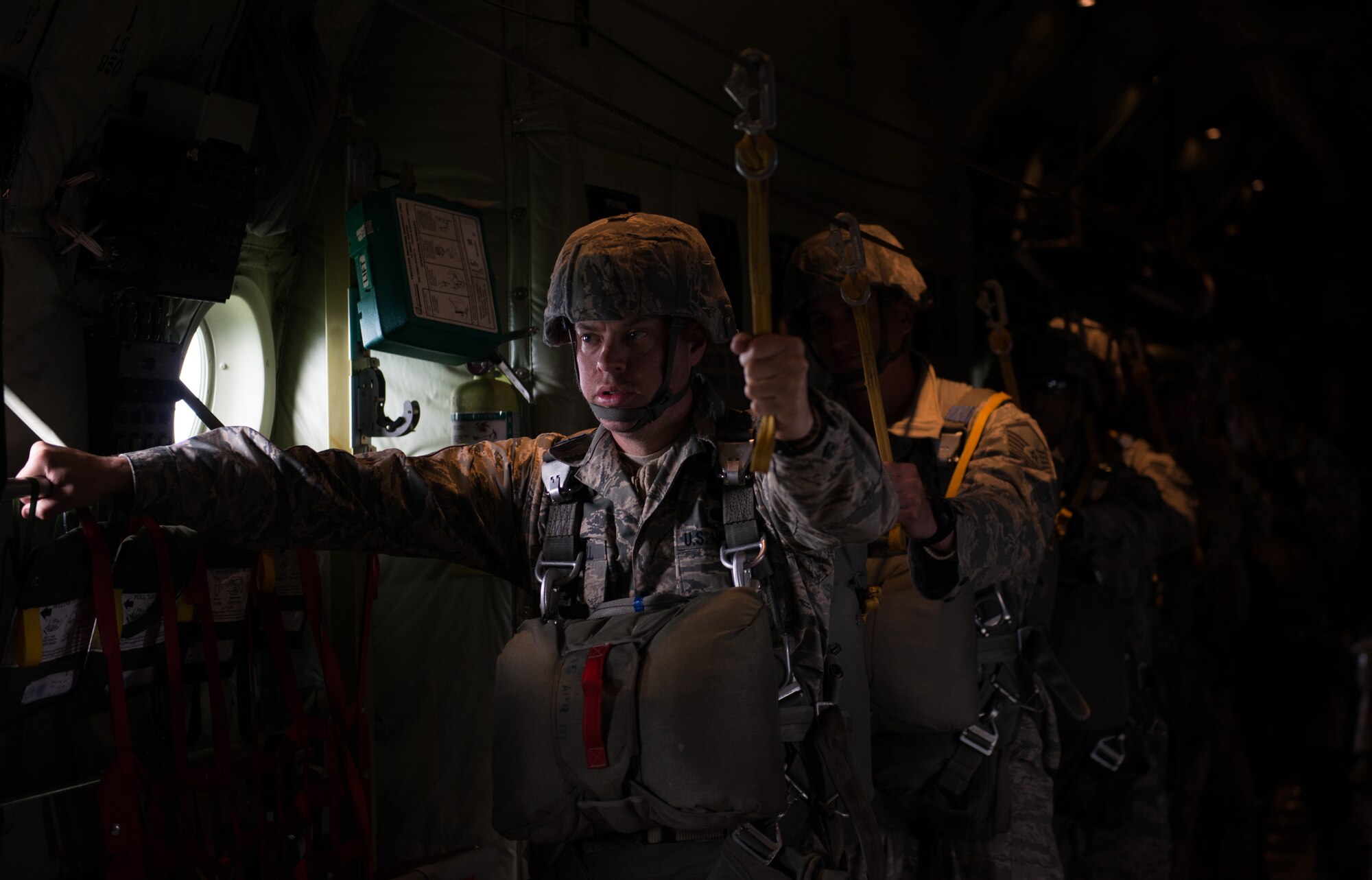 Tech. Sgt. Brian Angell 435th Contingency Response Group personnel parachute program manager, waits to jump out of a C-130 J-model during the Air Force-specific portion of Saber Strike at Lielvarde Air Base, Latvia, June 17, 2014. During the final week of Saber Strike 2014 the 435th CRG, in conjunction with the 37th Airlift Squadron, trained on the full capabilities to open the Latvian air base. They also trained with Latvian and Estonian service members on airfield operations, command and control of air and space forces, weather support, and protection of operational forces, aircraft maintenance and aerial port services. (U.S. Air Force photo/Senior Airman Jonathan Stefanko)