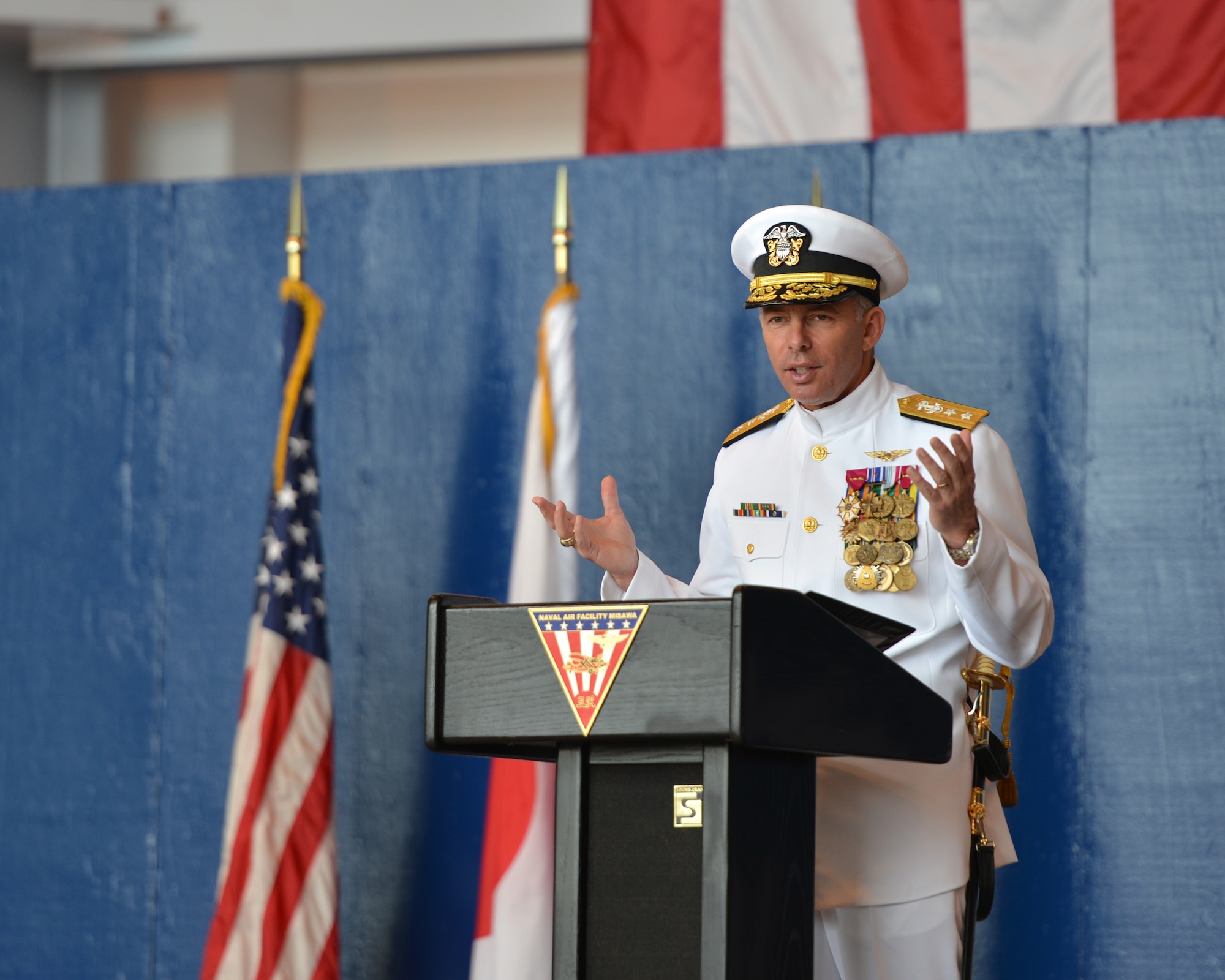 Rear Adm. Terry Kraft, U.S. Naval Forces Japan commander, serves as guest speaker during the Naval Air Facility (NAF) Misawa Change of Command Ceremony, June 20, 2014. During the ceremony, Capt. Keith Henry assumed command of NAF Misawa from Capt. Chris Rodeman. NAF Misawa is a U.S. naval installation located in northern Japan. (U.S. Navy photo by Mass Communication Specialist 3rd Class Erin Devenberg/Released)