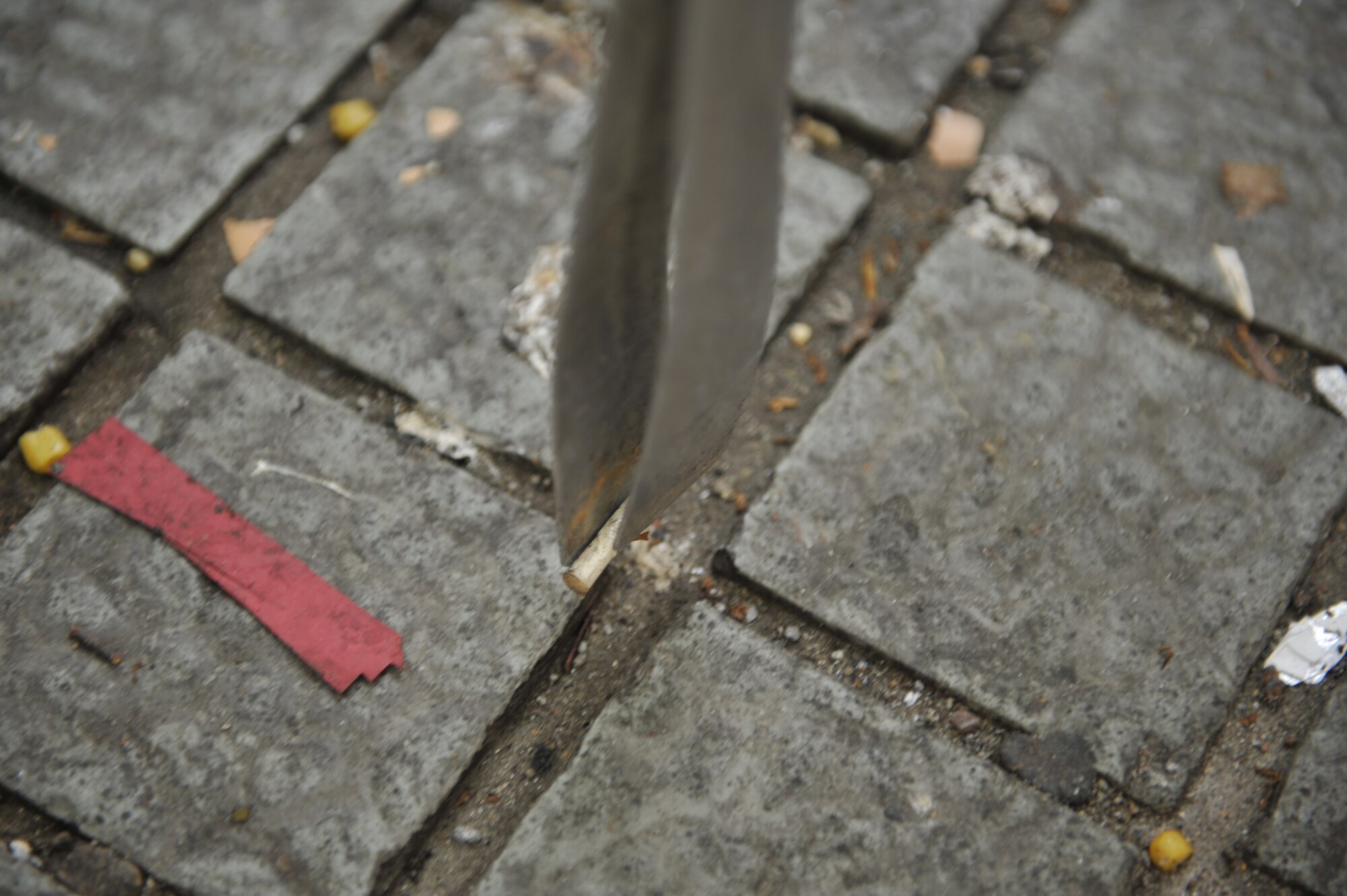Senior Airman Shamika Smith, 607th Support Squadron C2 systems administrator, picks up a cigarette butt during a Troops for Trash event in the Songtan Entertainment District, Republic of Korea, June 14, 2014. The volunteers went on an 8-mile hike through Songtan and a Buraksan Mountain trail. (U.S. Air Force photo/Senior Airman David Owsianka)