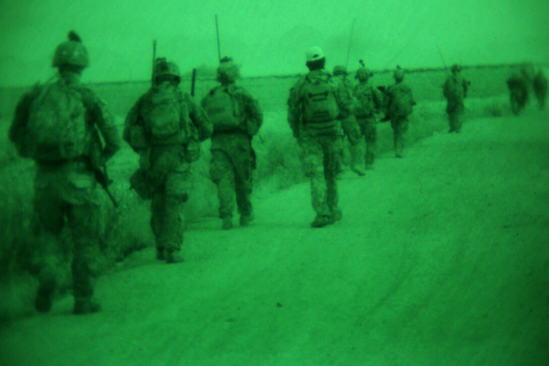 U.S. soldiers patrol through Qalah-Yeaja village in Afghanistan's Parwan province, June 13, 2014.