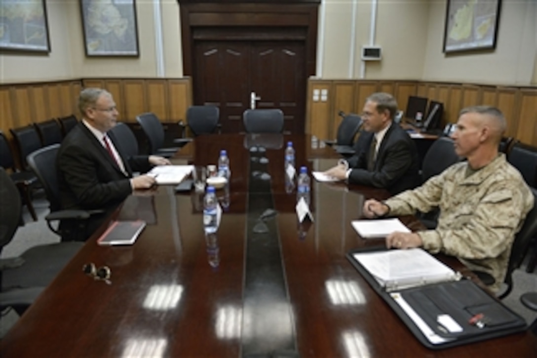 U.S. Deputy Defense Secretary Bob Work, left, meets with Earl Litzenberger, deputy senior civilian representative to NATO, at International Security Assistance Force headquarters in Kabul, Afghanistan, June 23, 2014. 