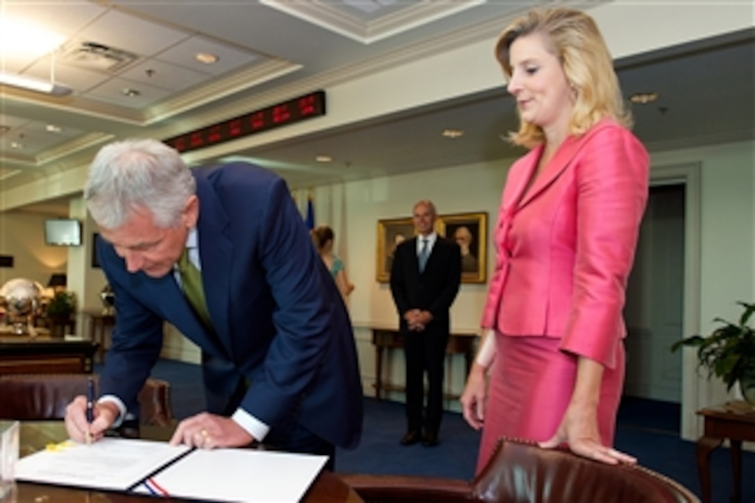 Defense Secretary Chuck Hagel swears in Christine E. Wormuth, new undersecretary of defense for policy, at the Pentagon, June 23, 2014. Wormuth previously served as deputy undersecretary of defense for strategy, plans and force development. 