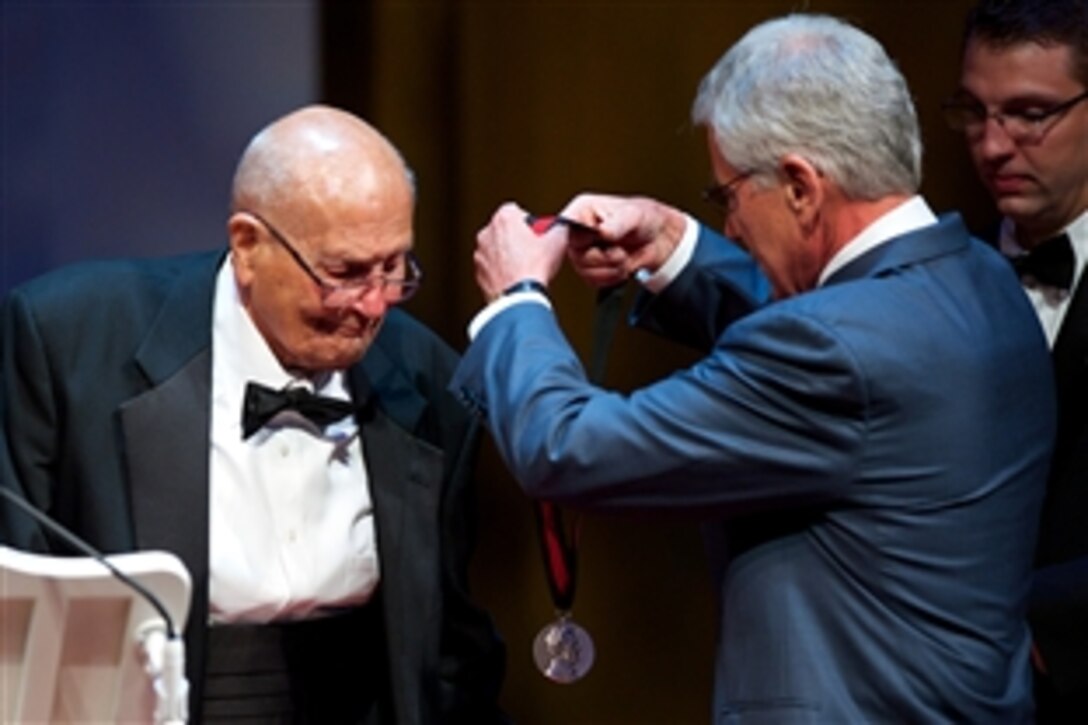 Defense Secretary Chuck Hagel, right, presents U.S. Rep. John D. Dingell Jr. of Michigan with the Lincoln Medal at Ford Theatre’s annual gala in Washington, D.C., June 22, 2014. The annual award is given to individuals, who through their work, accomplishments or personal attributes, exemplify the legacy and character embodied by President Abraham Lincoln. 