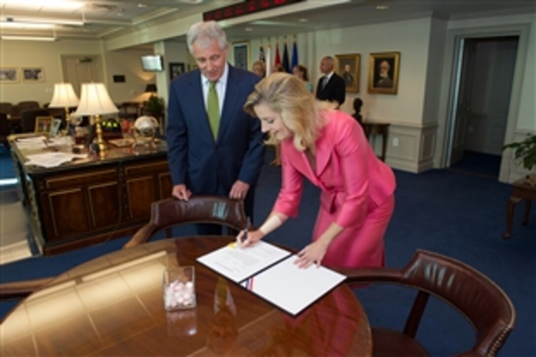 Defense Secretary Chuck Hagel swears in Christine E. Wormuth, new undersecretary of defense for policy, at the Pentagon, June 23, 2014. Wormuth previously served as deputy undersecretary of defense for strategy, plans and force development. 