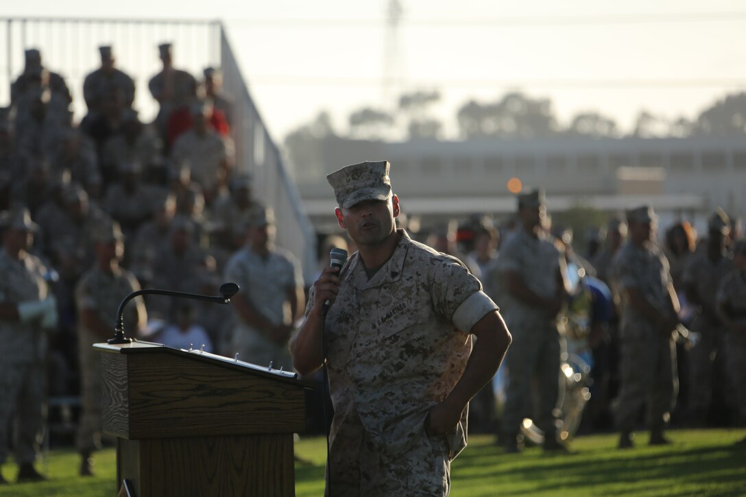 Sgt. Julio Vegaflores, reviewing officer, speaks during an evening colors ceremony aboard Marine Corps Air Station Miramar, Calif., June 23. Cpl. William “Kyle” Carpenter, Medal of Honor recipient, attended the ceremony as the guest of honor and spoke about the impact noncommissioned officers can make on junior Marines.