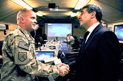 Army Col. Andy L. Hall, the commander of the 648th Maneuver Enhancement Brigade and Task Force Hydra, welcomes the Republic of Bulgaria's President, Rosen Plevneliev, to Camp Phoenix Feb. 29, 2012. 