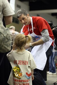 Dozens of Delta volunteers showed up to help at a Serving Our Troops event at the RiverCentre in St. Paul, Minn. Feb. 25, 2012. More than 3,000 steak dinners were served to the families of deployed Minnesota National Guard 1st Brigade Combat Team Soldiers, while approximately 13,000 steak dinners were simultaneously served to service members at five military bases in and around Kuwait City. Throughout the meal, families were connected with their Soldier through live video feed and chats. This is the ninth project for the Minnesota-based group, with more than 70,000 steak dinners being served around the world since 2004.