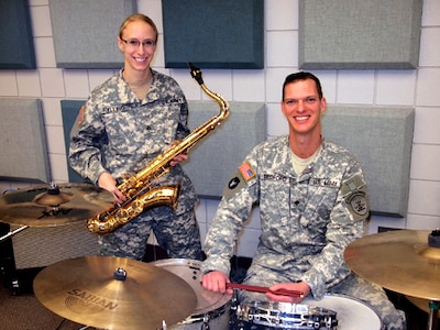 Army Sgt. DeAnn Fylling, left, has been named 2011 Reserve Component Army Band Junior Noncommissioned Officer of the Year while Army Spc. Aaron Bedford is runner-up for the 2011 Reserve Component Army Band Soldier of the Year. Both Soldiers are members of the North Dakota National Guard's 188th Army Band.