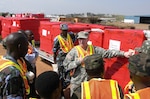 Army Maj. Tony Miller of the Tennessee National Guard explains shipping labels on outbound cargo during a recent training event where Africa Deployment Assistance Partnership Teams traveled to Uganda from Feb. 20 to Feb. 24, 2012 to conduct Phase I training for 27 members (17 Army and 10 Air Force) of the Uganda People's Defense Force.