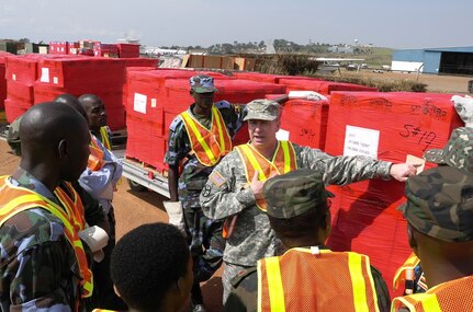 Army Maj. Tony Miller of the Tennessee National Guard explains shipping labels on outbound cargo during a recent training event where Africa Deployment Assistance Partnership Teams traveled to Uganda from Feb. 20 to Feb. 24, 2012 to conduct Phase I training for 27 members (17 Army and 10 Air Force) of the Uganda People's Defense Force.