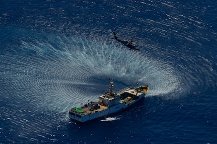 An HH-60G Pave Hawk rescue helicopter from the California Air National Guard's 129th Rescue Wing hovers over the Chinese fishing vessel Fu Yuan Yu #871, March 12, 2012. Guardian Angel Pararescuemen from the wing rescued two fishermen who were burned in a diesel fire onboard the vessel more than 700
miles off the coast of Acapulco, Mexico.