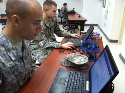 Army Pvt. Travonce Marquiese Covey, reads through questions during an online high school class at the National Guard Patriot Academy, Jan. 17, 2012 in Butlerville, Ind. Covey earned an accredited high school diploma, March 2, 2012 and reported to Fort Sill, Okla., for his advanced individual training.