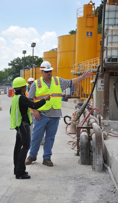 Center Hill Dam resident engineer Bill Debruyn explains how they store the equipment used to repair the dam to Phyllis Watson, a Huntsville Center contract specialist who supports the energy team. Participants in Huntsville Center's Leadership Development Program II toured Nashville District's Center Hill Dam in Lancaster, Tennessee June 17. Watson, who was an electrician in the Army, cross-trained as a carpenter and worked with heavy equipment Soldiers, found the tour very interesting and a bit nostalgic.