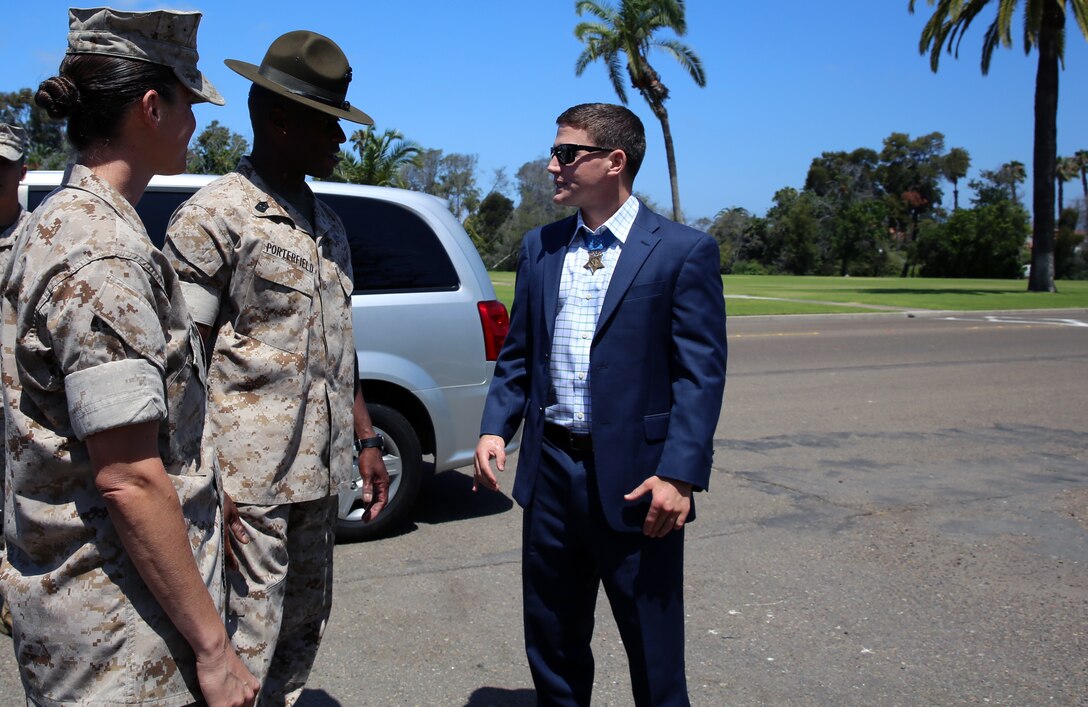 Corporal William K. Carpenter, Medal of Honor recipient, meets Sgt. Maj. James K. Porterfield, sergeant major, Marine Corps Recruit Depot San Diego, Western Recruiting Region, aboard MCRDSD, June 23.  Carpenter was recently awarded the Medal of Honor for his gallantry and intrepidity at the risk of his live above and beyond the call of duty. 