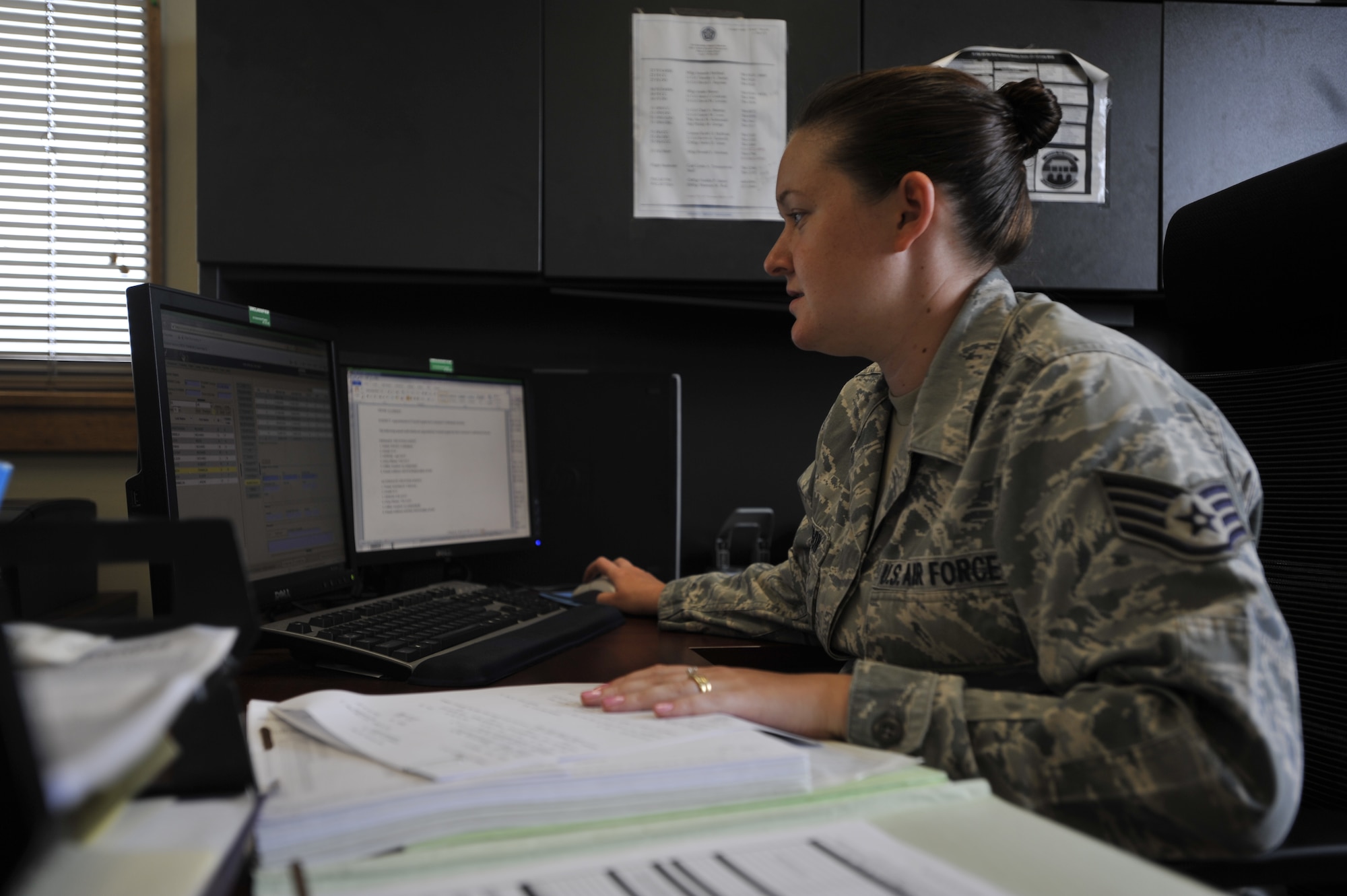 Staff Sgt. Kristine Clawson, 51st Operations Support Squadron aviation resource manager, changes a pilot’s aviation service code on Osan Air Base, Republic of Korea, June 23, 2014. Clawson is this week’s Airman Spotlight winner. (U.S. Air Force photo/Senior Airman David Owsianka) 