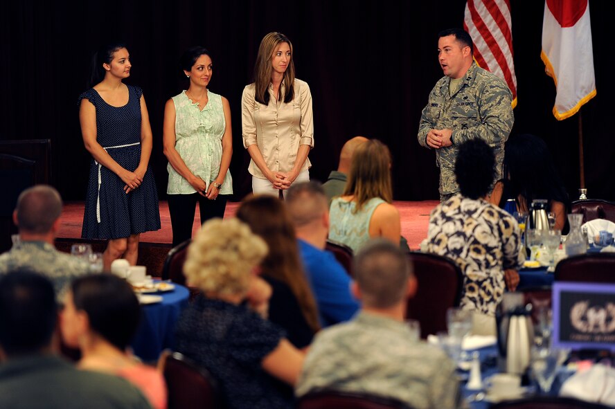 U.S. Air Force Capt. Steve Brenoskie, 18th Security Forces Squadron operations officer, recognizes 18th SFS key spouses during the Key Spouse Appreciation Breakfast on Kadena Air Base, Japan, June 18, 2014. During the event, more than 15 unit representatives spoke about the hard work and efforts of key spouses throughout the last year. (U.S. Air Force photo by Senior Airman Maeson L. Elleman)