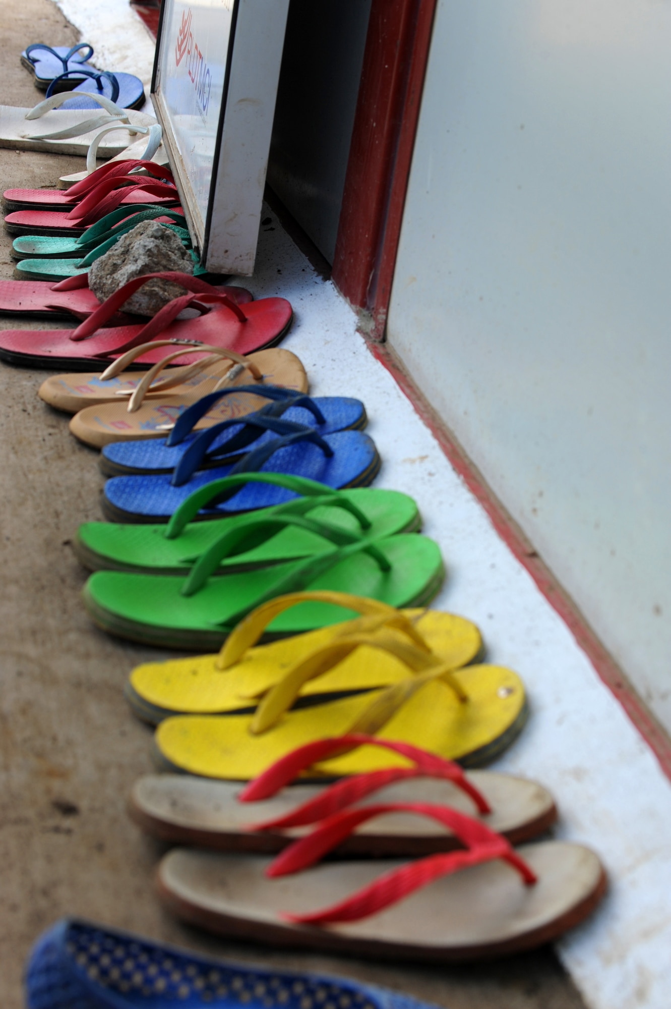 Students’ shoes are lined up outside of a classroom at Buyong Elementary School in Barangay Maribago, Lapu-Lapu City, Philippines June 18, 2014. More than 60 students attend class in a single room throughout the day. In an effort to relieve pressure off of teachers, 25 Airmen from the 374th CES spent 31 days building two classrooms and renovating utilities throughout the school. Pacific Unity is a bilateral Engineering Civic Action Program conducted in the Asia-Pacific region in collaboration with host nation military personnel. (U.S. Air Force photo by Staff Sgt. Amber E. N. Jacobs/Released)