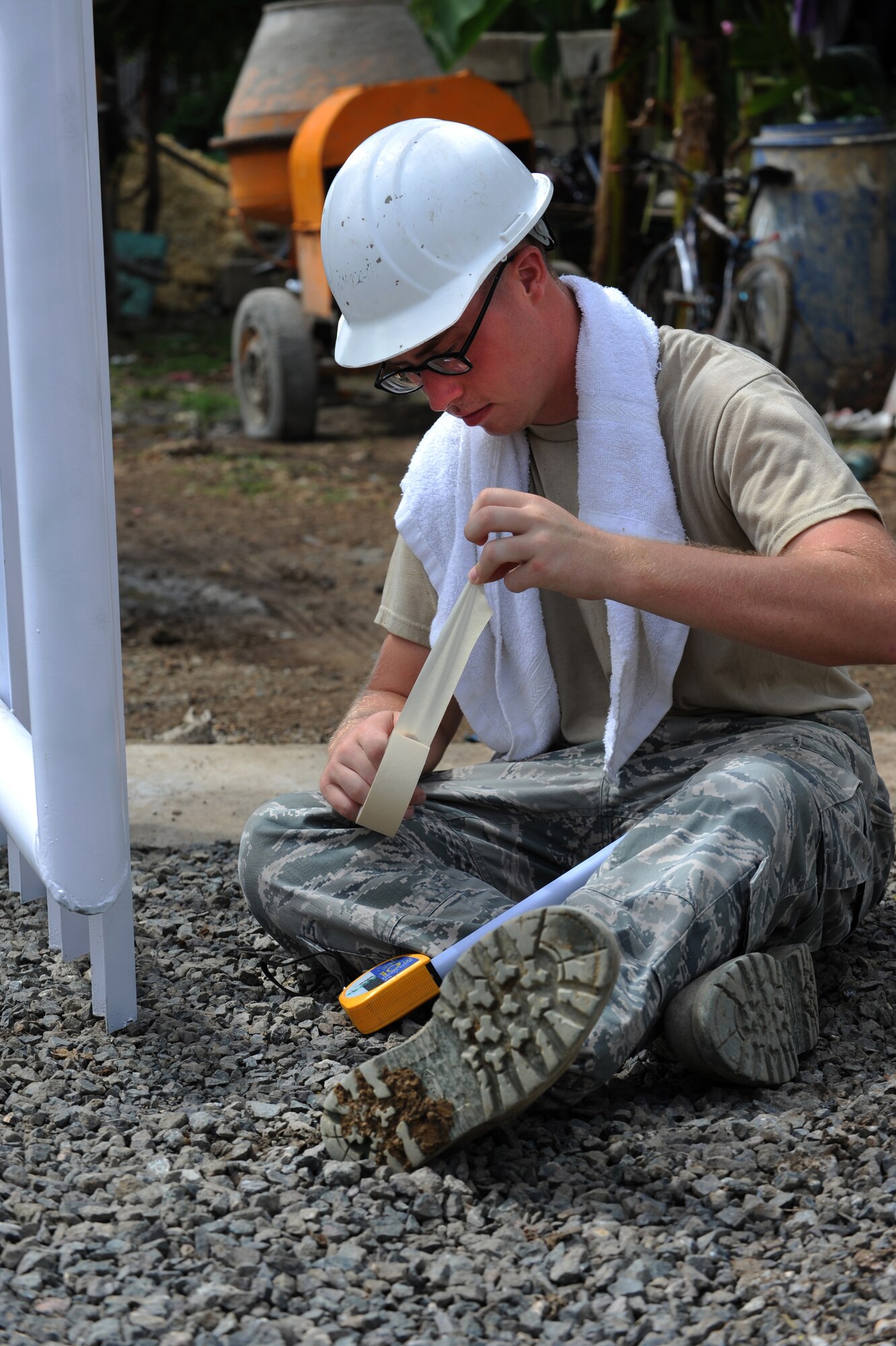 U.S. Air Force Airman 1st Class Cody Collins, 374th Civil Engineer Squadron Heating, Ventilation, Air and Conditioning apprentice, Yokota Air Base, Japan, prepares to paint a gate Buyong Elementary School in Barangay Maribago, Lapu-Lapu City, Philippines June 18, 2014. Airmen from the 374th CES spent 31 days building two classrooms and renovating utilities throughout the school as part of Pacific Unity 14-6, a bilateral engineering program meant to strengthen ties with regional partners throughout the Asia-Pacific region. (U.S. Air Force photo by Staff Sgt. Amber E. N. Jacobs/Released)
