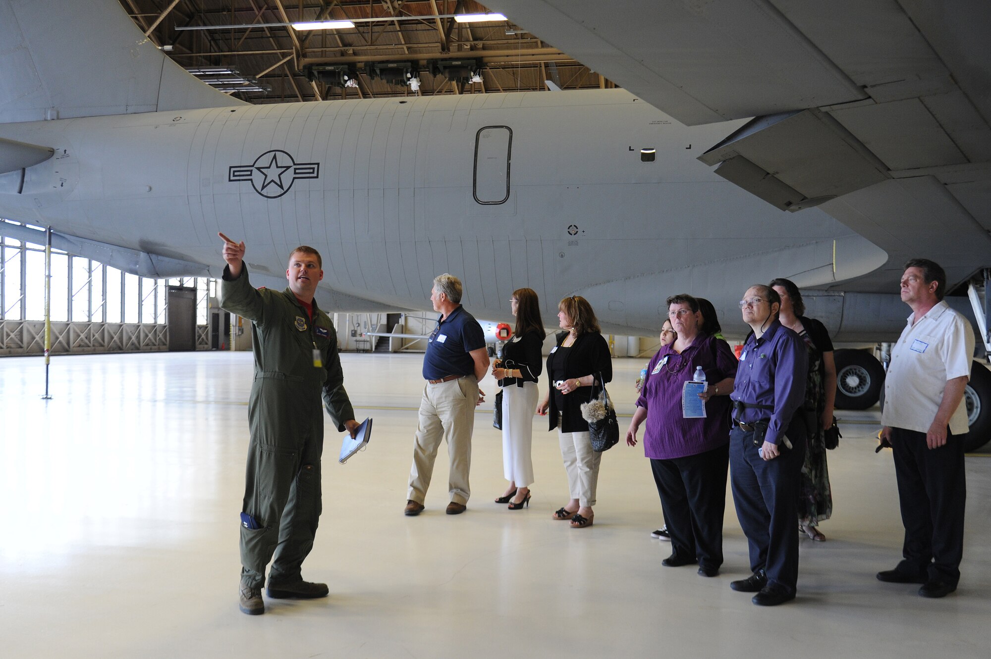 Airman 1st Class John Lewis shows family and friends of those involved in the fatal hospital shooting that took place 20 years ago at Fairchild Air Force Base, Wash., June 20, 2014. These individuals received a tour as part of a base-wide remembrance for the lives lost that day in 1994, when an active-shooter opened fire in the base hospital. Lewis is the 92nd Operations Support Squadron air traffic control apprentice. (U.S. Air Force photo by Airman 1st Class Janelle Patiño/Released)