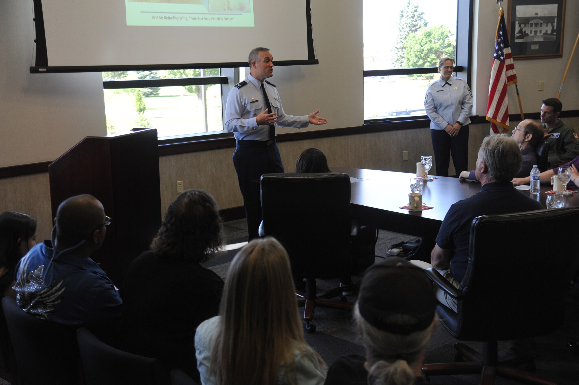 Col. Brian Newberry talks with family and friends of those involved in the fatal hospital shooting that took place 20 years ago at Fairchild Air Force Base, Wash., June 20, 2014. These individuals received a tour as part of a base-wide remembrance for the lives lost that day in 1994, when an active-shooter opened fire in the base hospital. Newberry is the 92nd Air Refueling Wing commander. (U.S. Air Force photo by Airman 1st Class Janelle Patiño/Released)